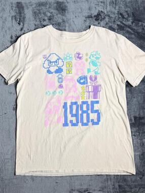 Nintendo Super Mario Bros 1985 Pastel Jumble Graphic T-Shirt Men’s Large Tan